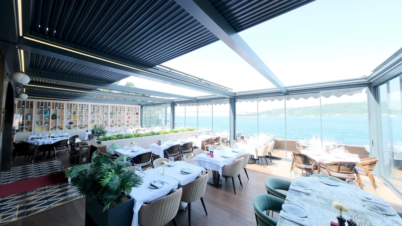 Retracted Royal pergola above a waterfront commercial dining terrace.