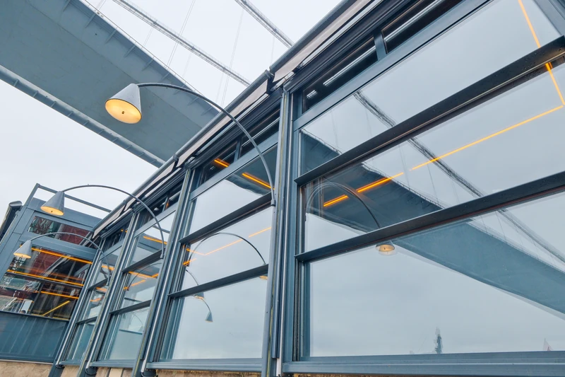 Upglass enclosure integrated into a commercial restaurant exterior.