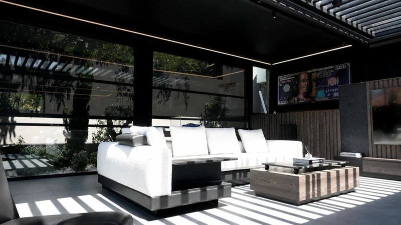 Zip Blind shading integrated into a commercial outdoor lounge.