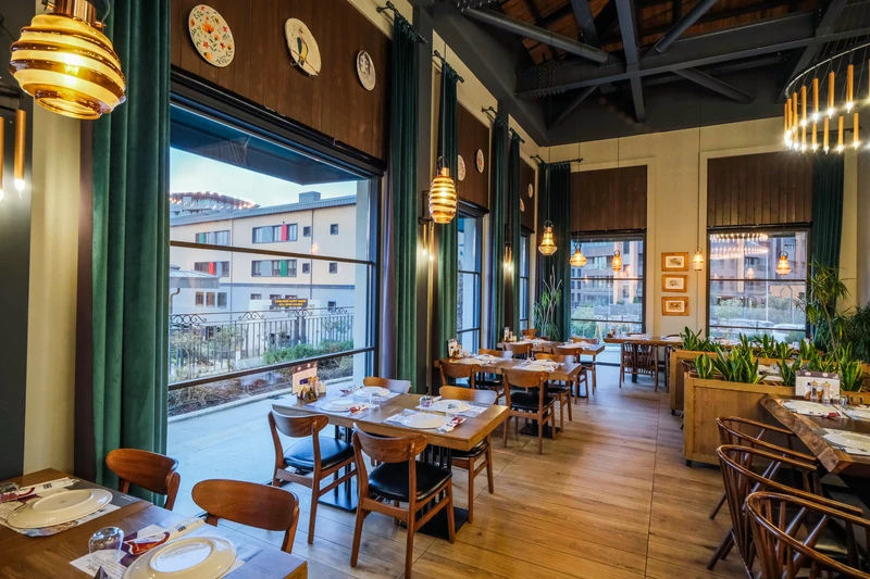 Fully enclosed Upglass system around a restaurant interior.
