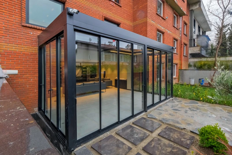 Railglass enclosure integrated with a residential outdoor room.