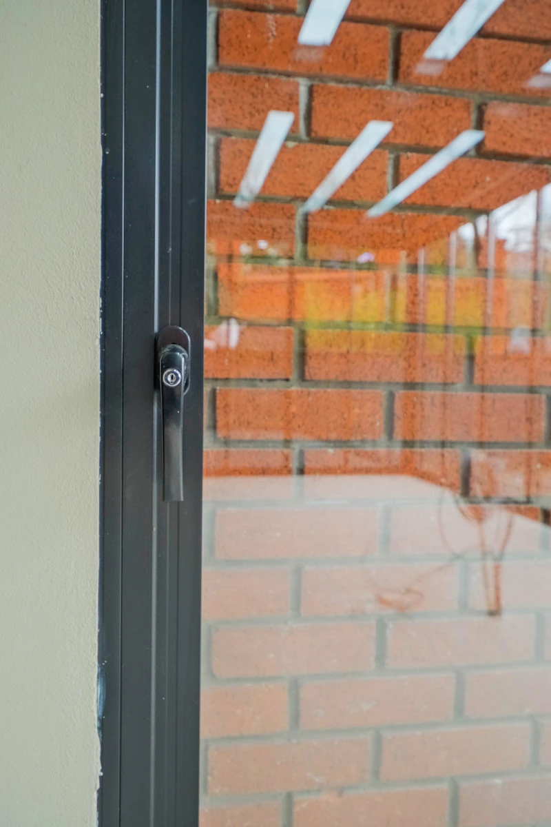 Detail of Railglass framing and sliding-panel hardware.