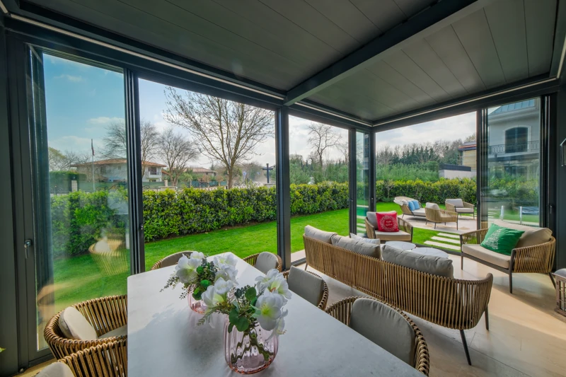 Railglass viewed from inside a bright residential dining and lounge space.