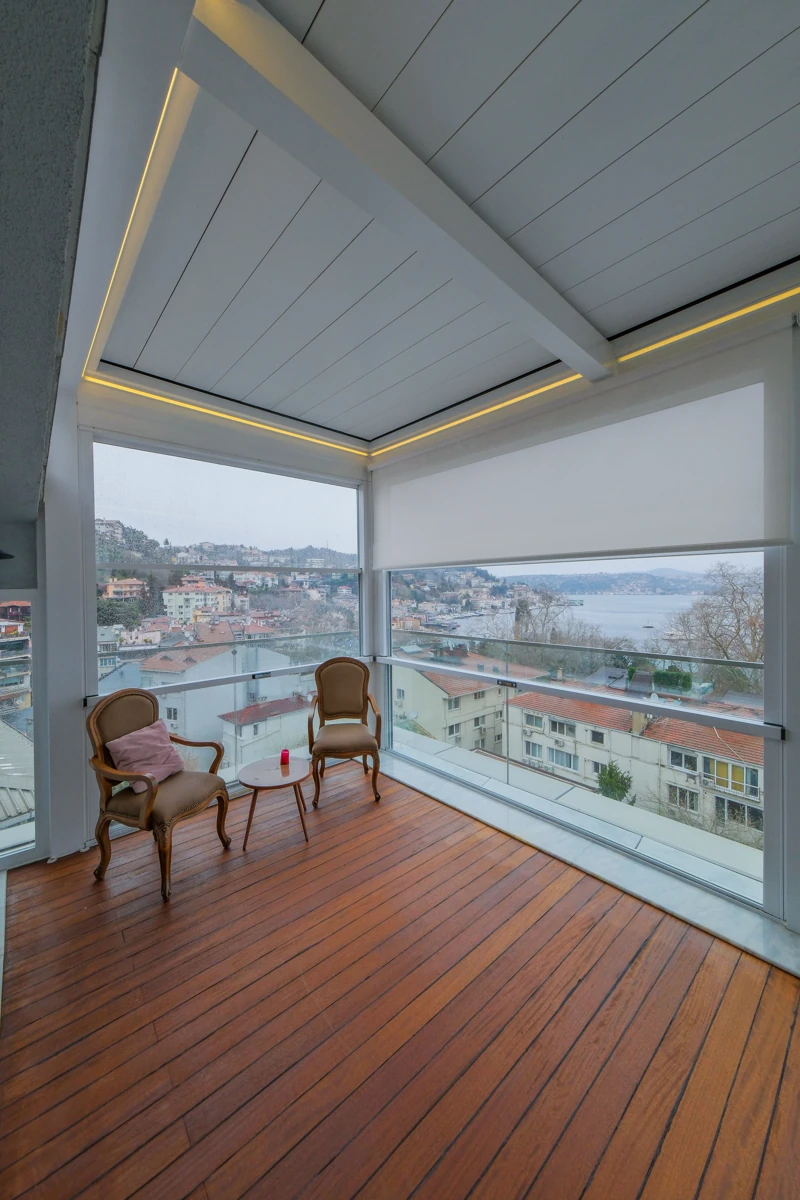 Closed Upglass panels preserving a wide view from a residential terrace.