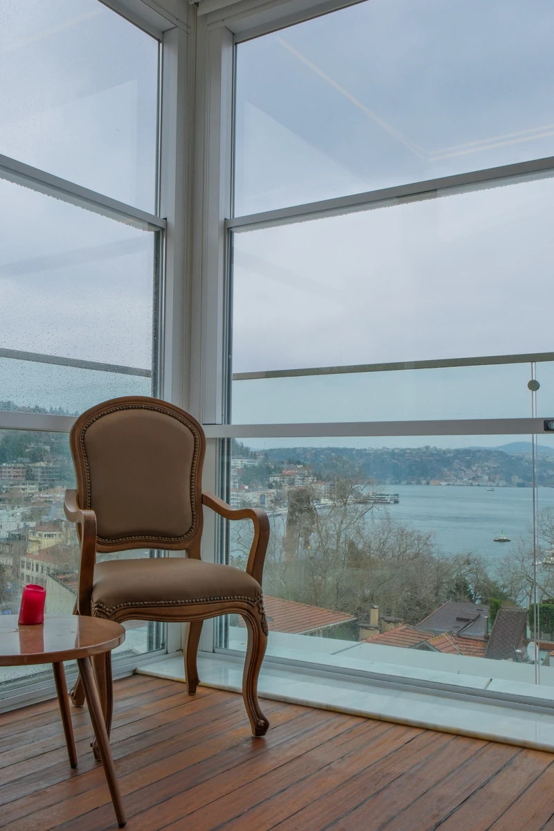 Upglass panels framing an open residential view.