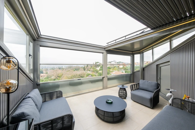 Residential lounge enclosed by Upglass beneath a pergola.